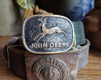 Old John Deere green strap belt and WWI German belt
