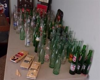 the round basket at the end is a collection of Match Books,  model Cars, Coke Clocks, and many, many Bottles