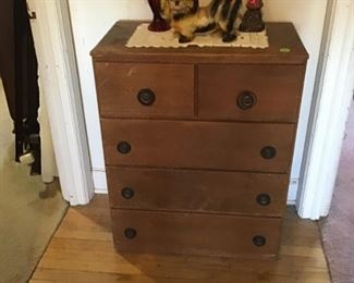 . . . a cute dresser with chalkware dog on top