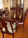 Solid wood (dark cherry stain) dining room table and six chairs