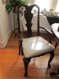 Solid wood (dark cherry stain) dining room table and six chairs