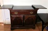 Solid wood buffet server, top opens to double serving space, on wheels