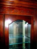 Beautiful extra large curio cabinet, glass shelves, mirrored back, lighted, nice carved detail