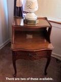 Pair of vintage (1930's or 40's) Dark Walnut step night stands, bow front, one drawer, original brass hardware, relief carved, custom cut glass top.