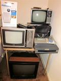 Four older TV's, different sizes - from 10" to 18" - Emerson, Sony, GE. Vintage ECG machine.