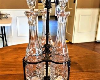 1870's  Three Bottle English silver-plate Tantalus with hand cut wine decanters