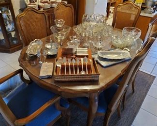 Beautiful cane backed dining set with 6 chairs, 2, 24" leaves and custom pads. 