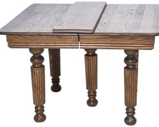 3. Carved Wooden Table with Leaf