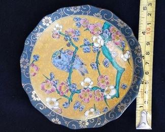 Small plate with bird decoration