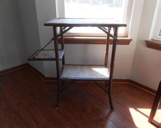 Unique bamboo table with a side shelf