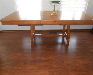 Beautiful dining table is 7' X 3.5' with the leaf in, w/o approximately 5'X3.5'