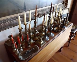 Several sets of pewter candlesticks