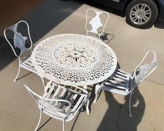 WOODARD IRON CHAIRS WITH BASKET OF FLOWERS, PRISTINE SHAPE , HEAVY ANTIQUE VICTORIAN CAST IRON TABLE SOLD SEPERATE