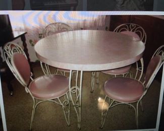 PINK FORMICA 1950'S IRON TABLE WITH HEART SHAPE CHAIRS $ 250.00 SET THE ITALIAN MID CENTURY IRON CHANDELIER WOULD BE PERFECT TO HANG ABOVE THIS TABLE
