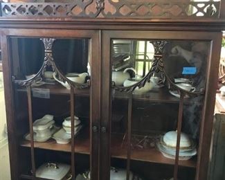 CHIPPENDALE WALNUT ANTIQUE SMALL CHINA CABINET, WITH A DRAWER, ORIGINAL FINISH, BEAUTIFUL CARVING, WOULD BE BEAUTIFUL IN ANY ROOM. PAUL MULLER WHITE PORCELAIN PIECES INSIDE,WITH GOLD ENCRUSTED EDGES, STUNNING FOR A HOLIDAY TABLE