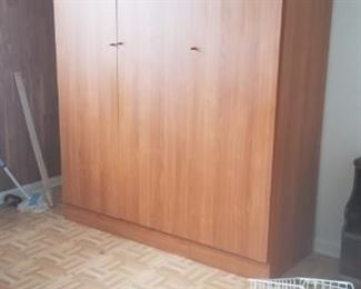 tall 3 door cabinet 58" long 21" depth and 85" height $50