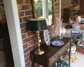 Foyer table with décor, wall mirror