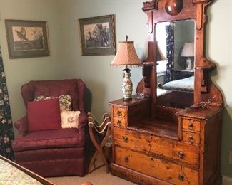 Eastlake dresser with mirror, arm chair, wooden luggage holder