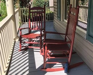 Two red wood rockers...