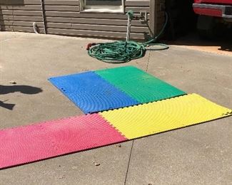 Colored mats, water hose