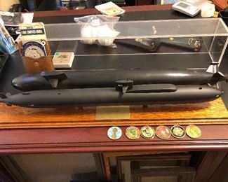 Scaled submarines, military coins ...