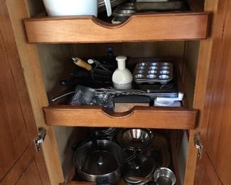 Full of cookware! Pots, pans, cookie sheets, cake pans, muffin pans, chopper, garlic press...