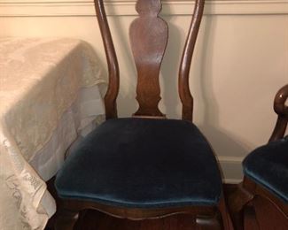 Set of 12 Walnut Reproduction Queen Anne Dining Back Chairs covered in blue velvet.  Fabulous and perfect.  Sturdy and ready to live another lifetime!!