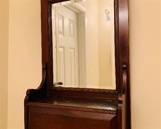 Wood framed wall mirror with storage