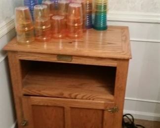 Oak furniture and plastic tumbles for use outdoors.