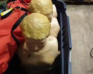 a toboggan of torsos with heads