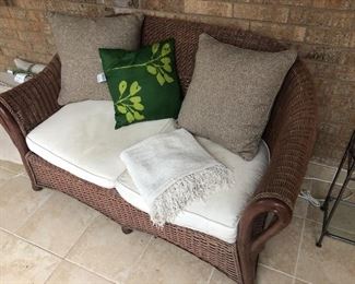 Wicker sofa and matching chair with ottoman