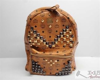 Nonauthenticated, MCM Leather BackPack
Brown Leather MCM Backpack w/ Metal Fixtures and multi pockets
