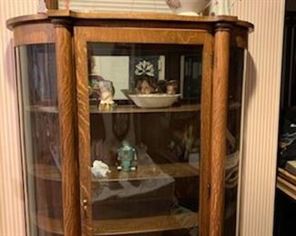 One of a kind, curved glass China cabinet. 