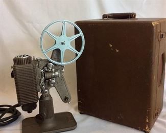 Vintage Revere Eight Model 85 8mm Projector. Lamp and motor are in working order. Note that case is not original. 
