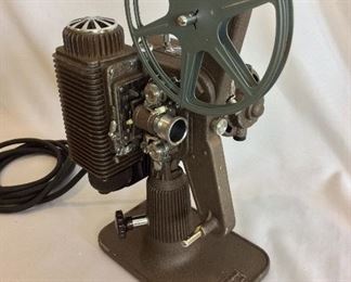 Vintage Revere Eight Model 85 8mm Projector. Lamp and motor are in working order. Note that case is not original. 