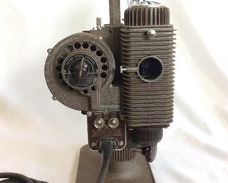 Vintage Revere Eight Model 85 8mm Projector. Lamp and motor are in working order. Note that case is not original.