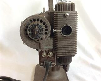 Vintage Revere Eight Model 85 8mm Projector. Lamp and motor are in working order. Note that case is not original. 