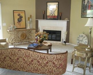Tapestry sofa, stone top wine storage table, painted side table, large clock, 3 French posters