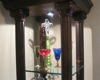 A pair of lighted four column display units. Crystal items.