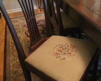 Needlepoint seats.