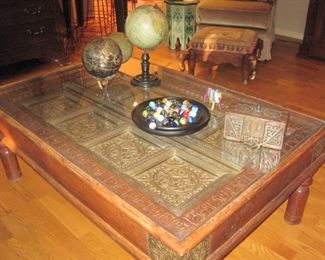 Glass topped Coffee Table with detailed copper plate accents.
