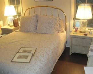 Queen Size bed with bedding.