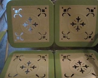 Vintage Metal Patio Furniture with decorative cutouts.