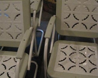 Vintage Metal Patio Furniture with decorative cutouts.