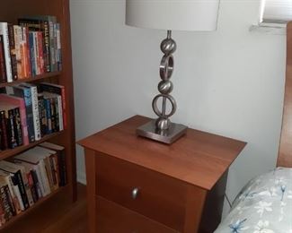Books and brushed nickel lamps