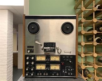 Vintage Teac reel to reel...weighs 400lbs! lol But is a hot ticket on the collectors market. Not sure it works...but think it would be an easy fix.
