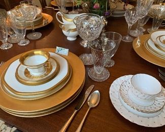 Chargers from Italy, China from England, flatware, vintage placecard tags...this dining room is awesome