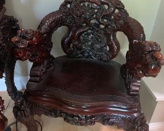 Pair of carved Asian themed chairs...must see to believe 