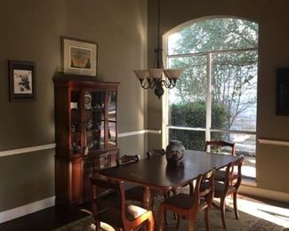 Duncan Phyfe dining table with six chairs and matching china hutch.  Large oriental rug