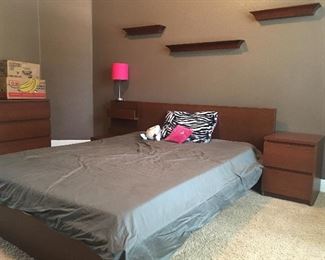 Modern low queen bed with nightstands.  Mattress included